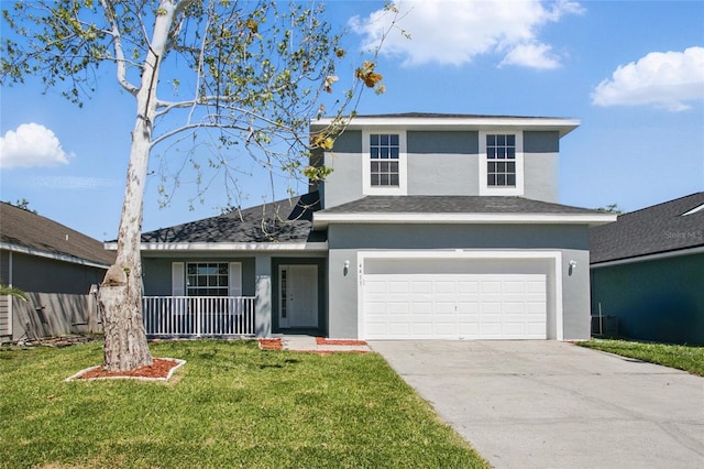 traditional-style house with stucco siding, a front lawn, concrete driveway, a shingled roof, and a garage