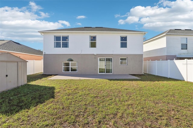 back of house with a fenced backyard, an outdoor structure, a storage unit, a patio area, and a lawn