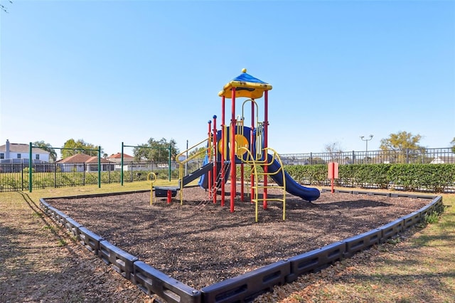 community jungle gym featuring fence