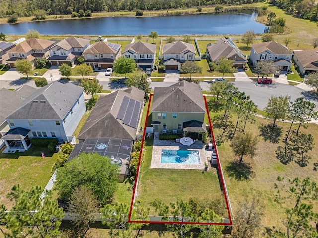 birds eye view of property featuring a residential view and a water view