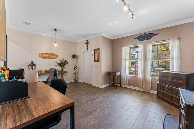 office space featuring visible vents, ornamental molding, baseboards, and wood finished floors