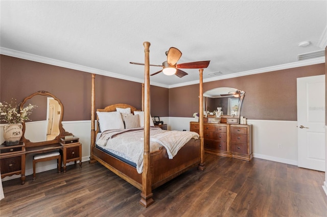 bedroom with ornamental molding, baseboards, and wood finished floors