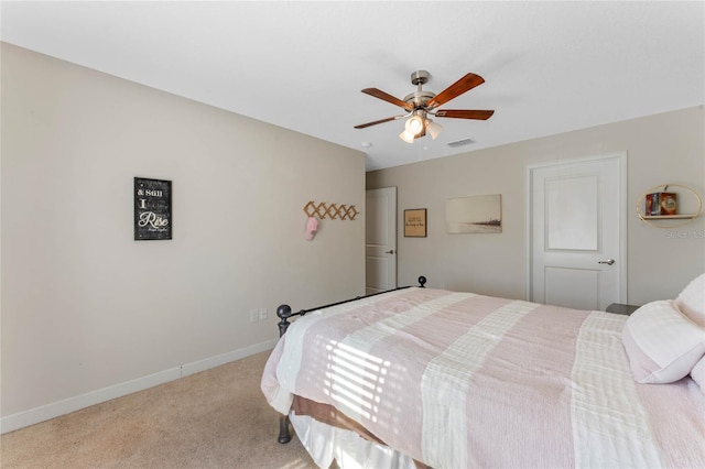 carpeted bedroom featuring baseboards, visible vents, and ceiling fan