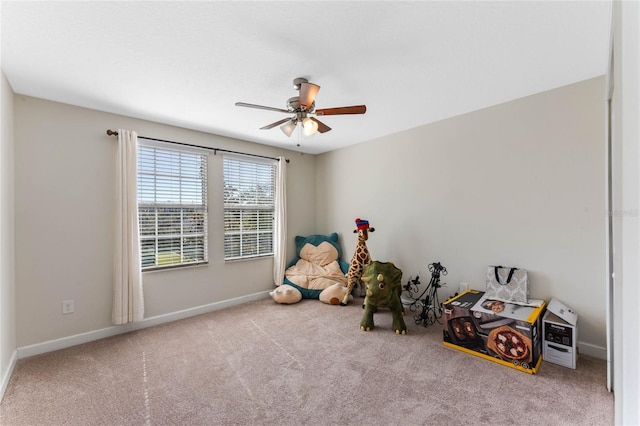 game room featuring baseboards, carpet, and ceiling fan