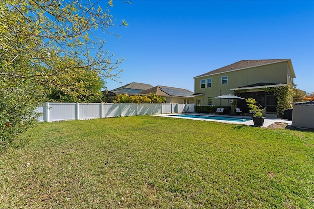 view of yard with a fenced in pool and a fenced backyard