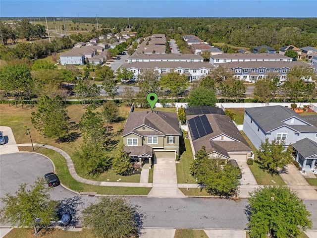 birds eye view of property with a residential view