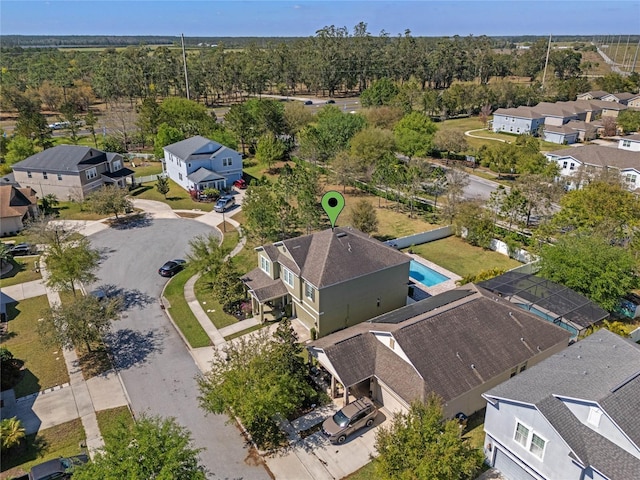 birds eye view of property with a residential view