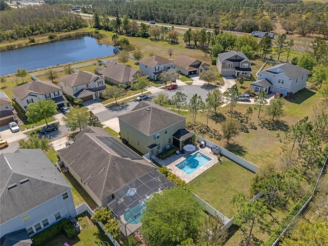 aerial view with a residential view and a water view