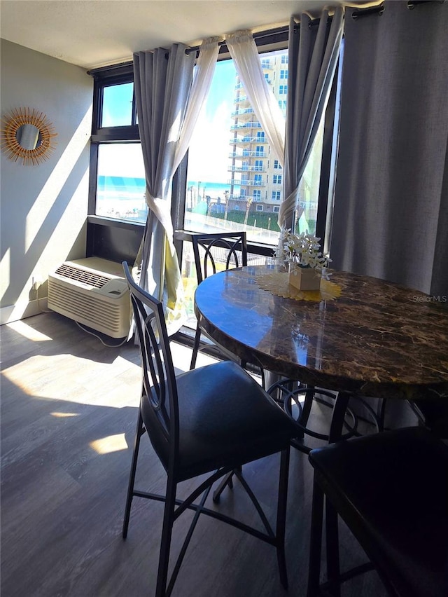 dining area with wood finished floors