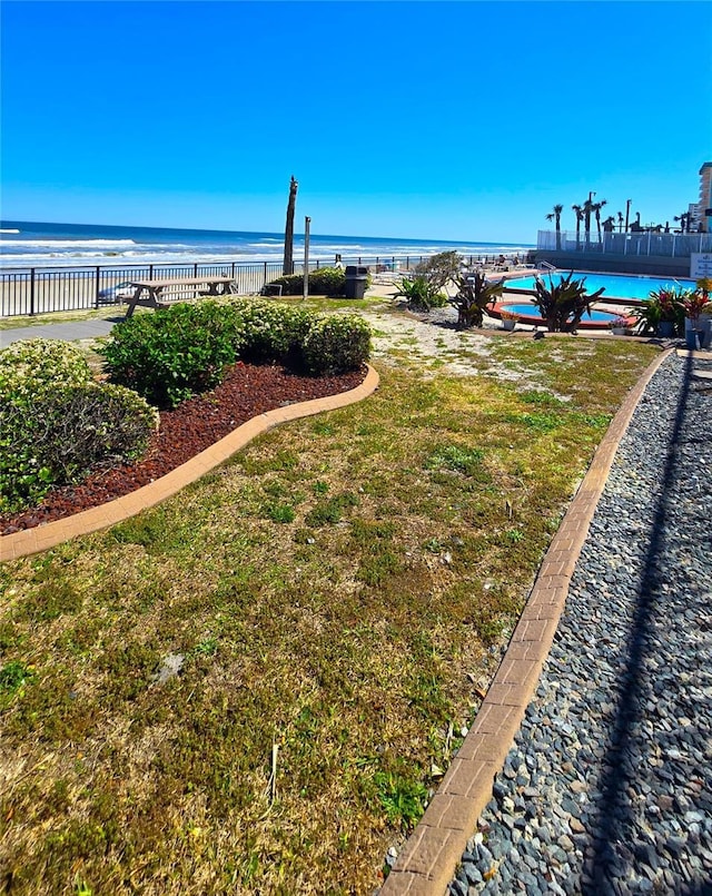 view of water feature with fence