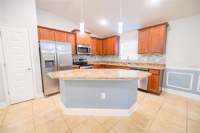 kitchen with a sink, light tile patterned floors, brown cabinetry, and stainless steel appliances