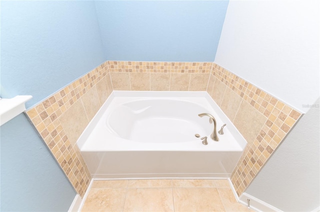 full bath featuring tile patterned floors and a garden tub