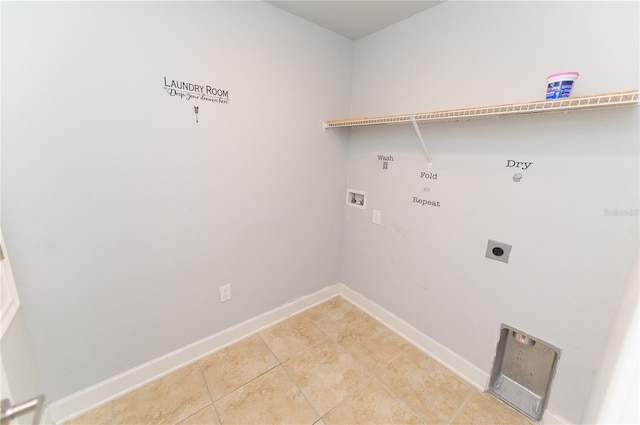 washroom with baseboards, laundry area, light tile patterned flooring, electric dryer hookup, and washer hookup