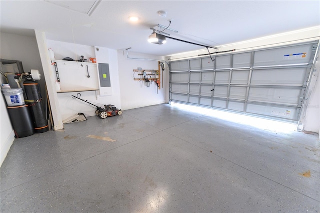 garage with electric panel and a garage door opener