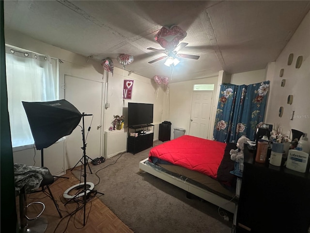 carpeted bedroom with a ceiling fan