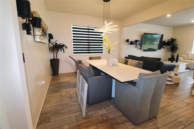 dining area featuring wood finish floors and recessed lighting