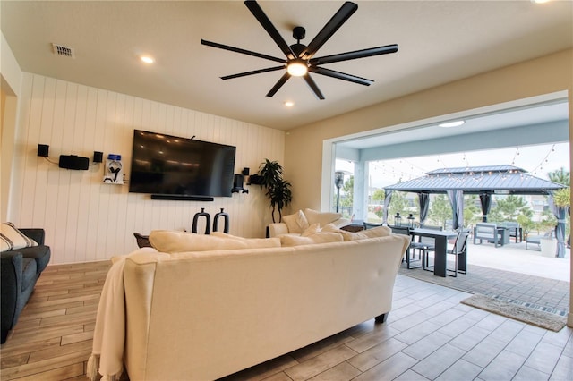 living area featuring wood tiled floor, recessed lighting, visible vents, and ceiling fan