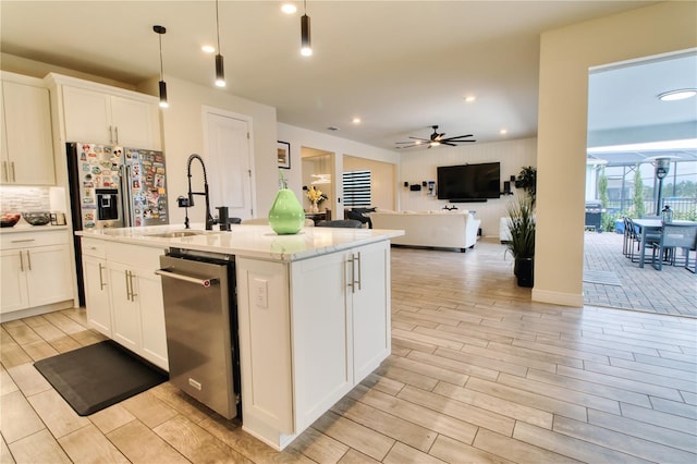 kitchen featuring backsplash, ceiling fan, wood tiled floor, and white cabinetry