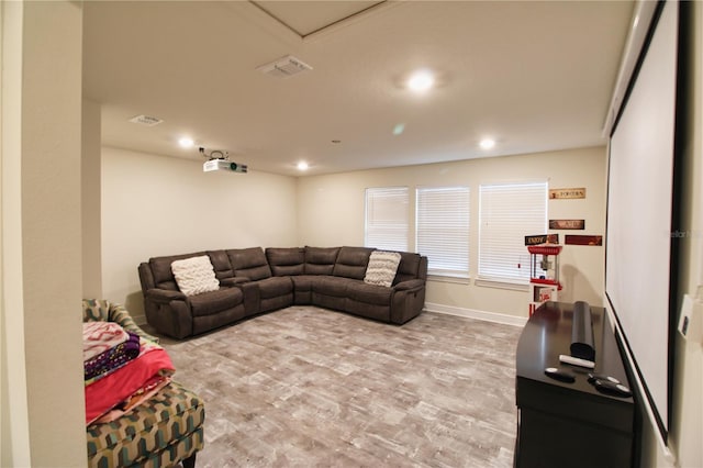 living area featuring recessed lighting, baseboards, visible vents, and light wood finished floors