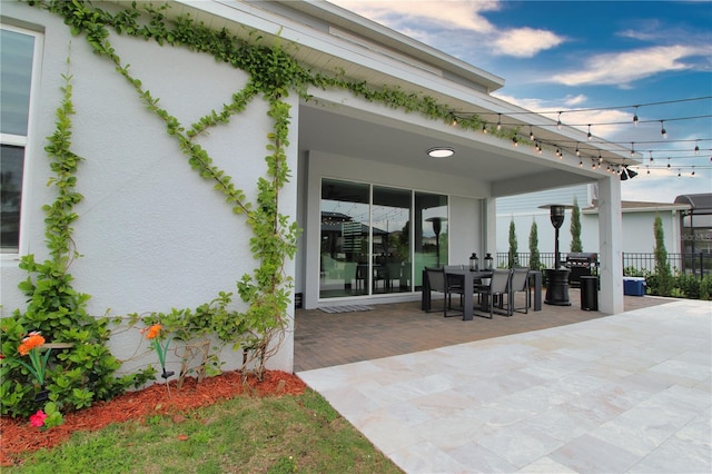 view of patio / terrace featuring outdoor dining area and fence