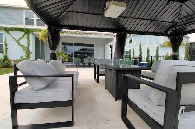 view of patio with a gazebo, outdoor dining space, outdoor lounge area, and fence