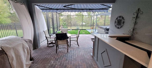 sunroom / solarium featuring plenty of natural light