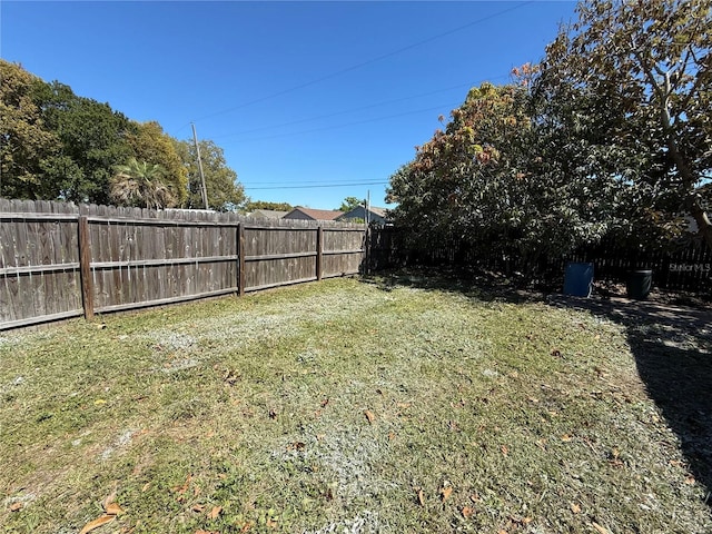 view of yard with a fenced backyard