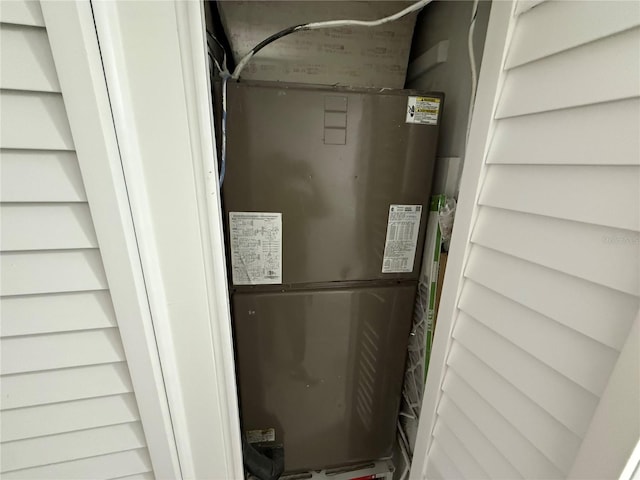 utility room featuring heating unit