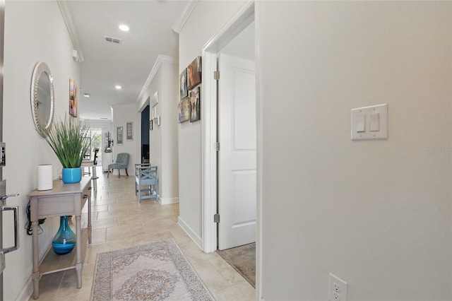 corridor with crown molding, recessed lighting, visible vents, and baseboards