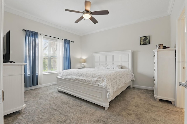 bedroom with ornamental molding, a ceiling fan, baseboards, and light carpet