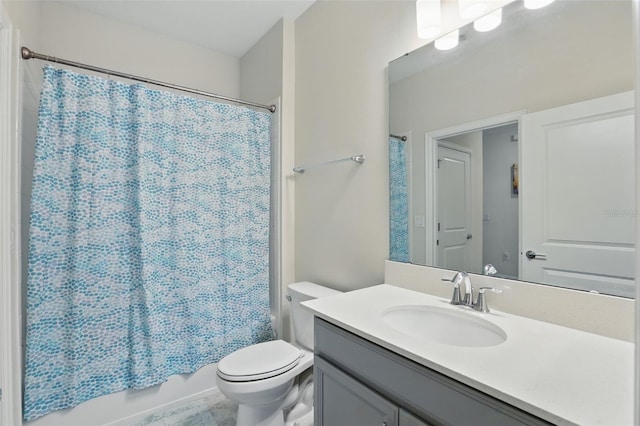 bathroom with toilet, shower / bath combo, and vanity