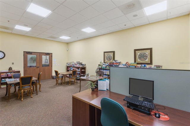 home office with a paneled ceiling and carpet floors