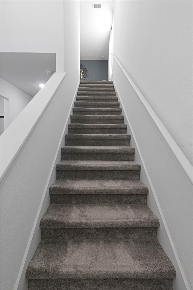 staircase with visible vents