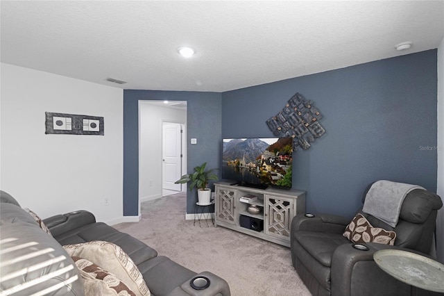 living room with visible vents, carpet floors, and baseboards