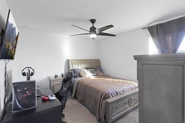 bedroom featuring light carpet and ceiling fan