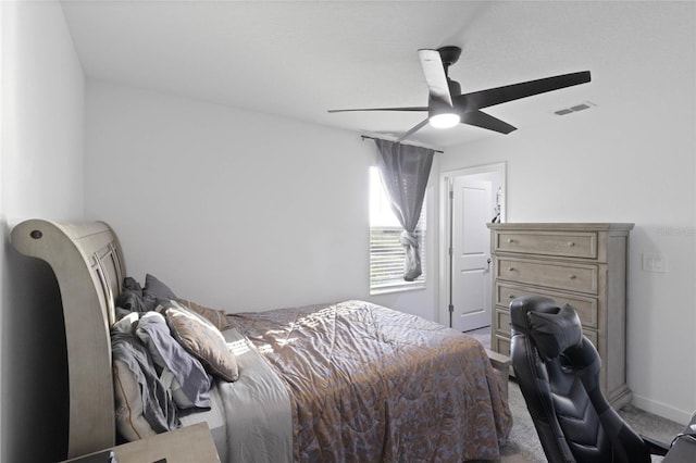 bedroom with visible vents, baseboards, a ceiling fan, and carpet flooring