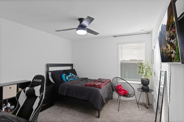 carpeted bedroom with a ceiling fan