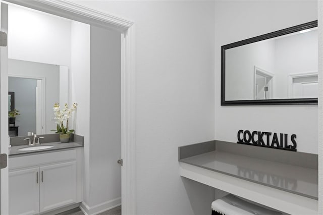 bathroom featuring vanity and baseboards