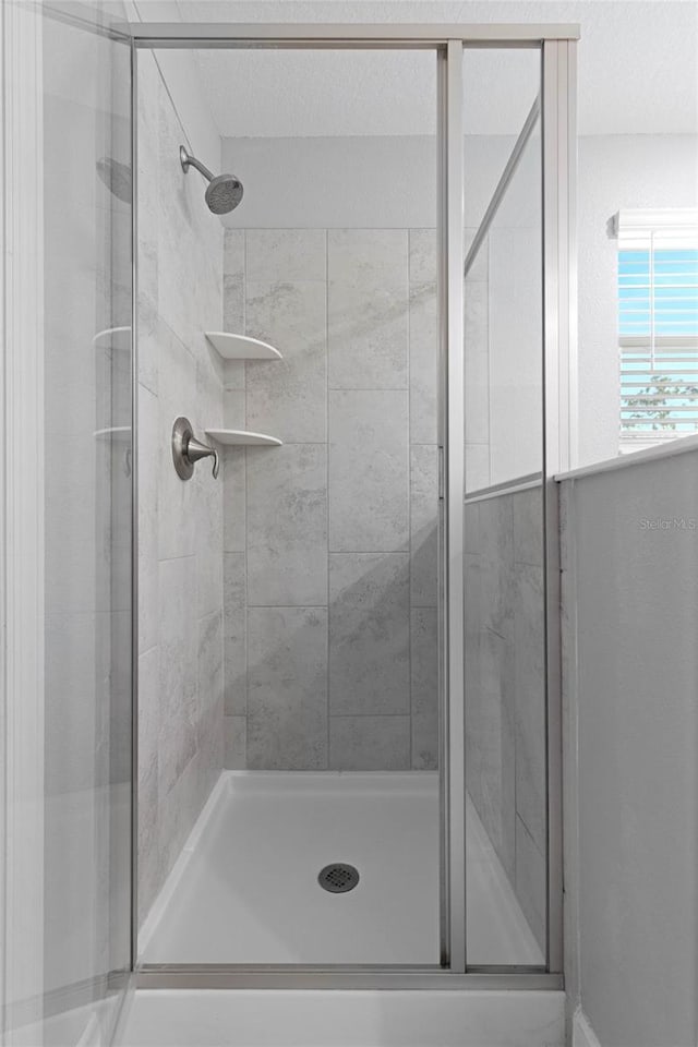 full bathroom featuring a stall shower