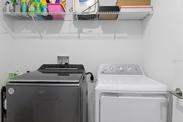 laundry area featuring washing machine and dryer and laundry area