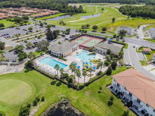 bird's eye view featuring view of golf course and a water view