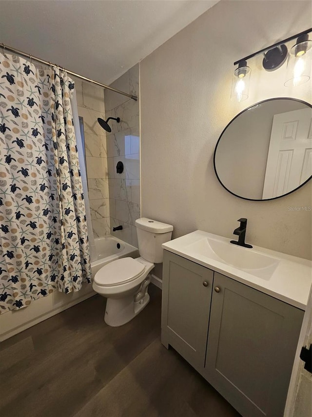 bathroom featuring vanity, toilet, shower / tub combo with curtain, and wood finished floors