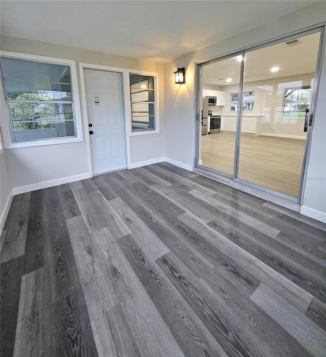 unfurnished sunroom featuring visible vents