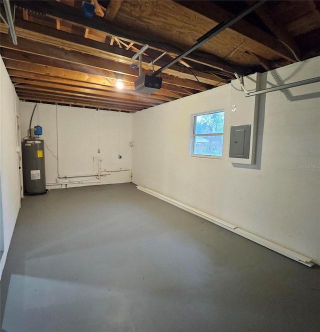 below grade area with water heater, electric panel, and a garage