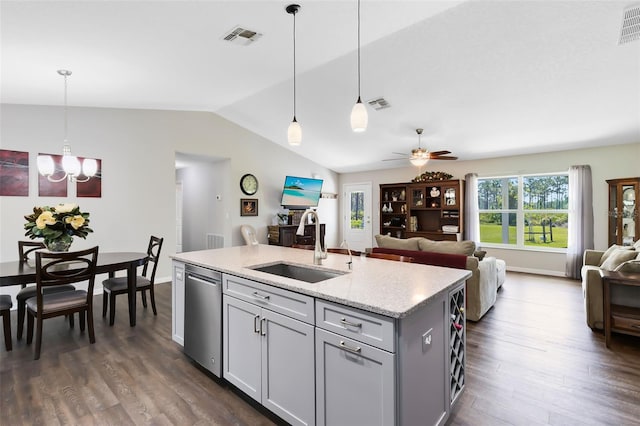 kitchen with visible vents, dishwasher, open floor plan, and a sink