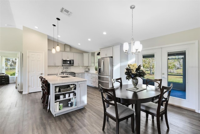 dining room with recessed lighting, visible vents, dark wood-style flooring, and a chandelier