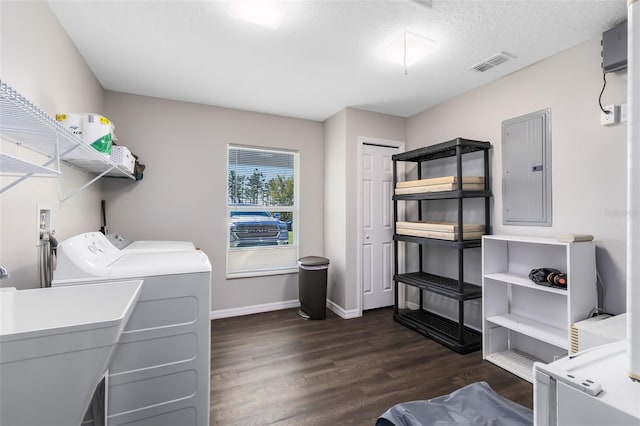 laundry room featuring visible vents, electric panel, laundry area, dark wood-style floors, and separate washer and dryer