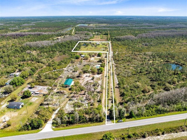 aerial view featuring a view of trees