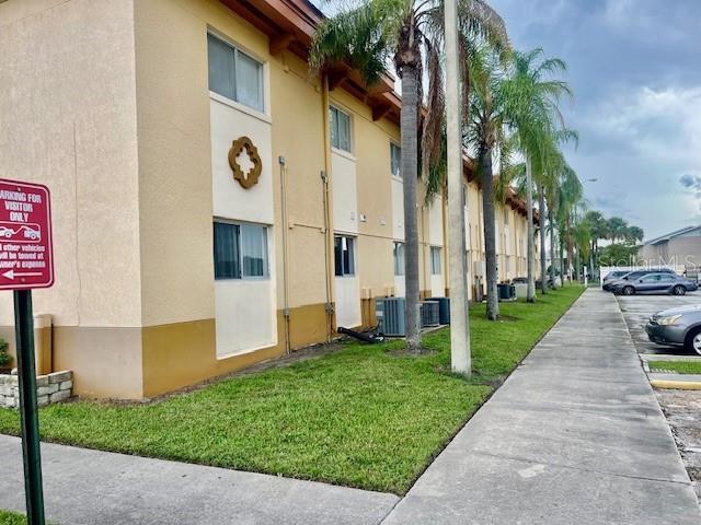 view of property with cooling unit and a residential view