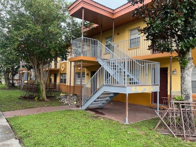 view of property featuring stairs